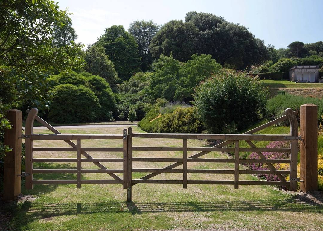 A wooden fence line along a property boundary