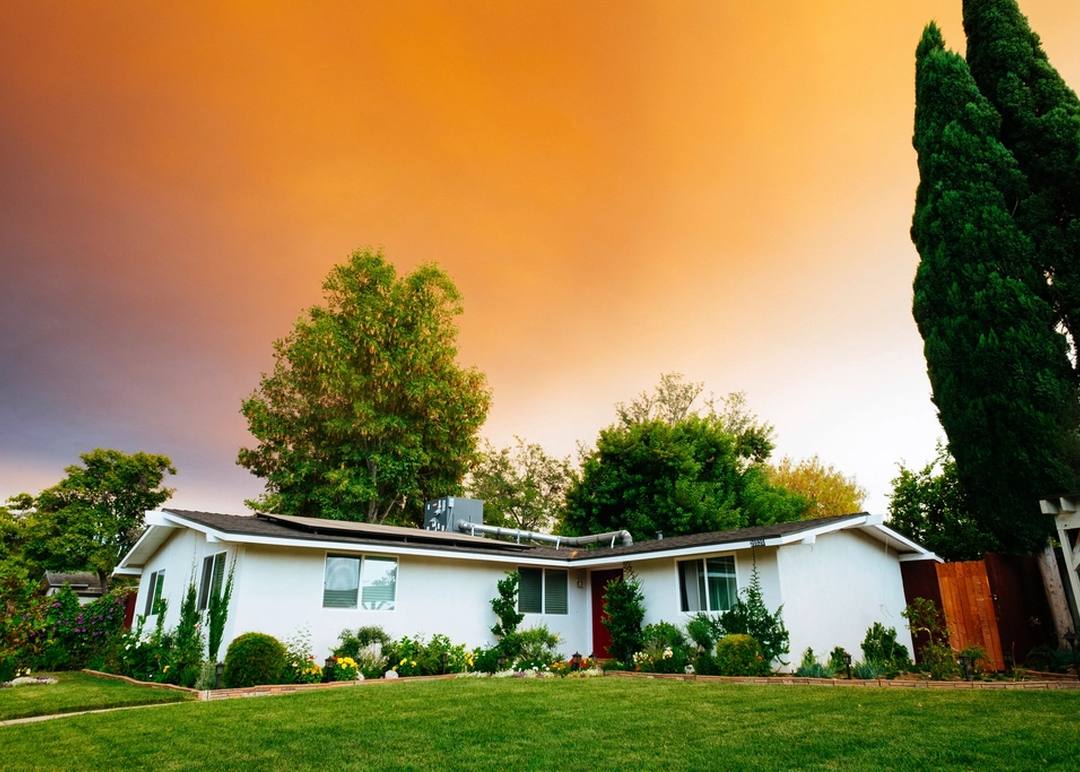 A suburban home with a maintained front lawn